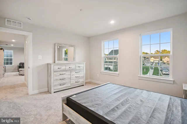 a view of room with cabinet and mirrors