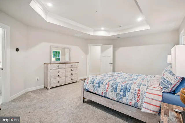 a bathroom with a double vanity sink a mirror and a bathtub