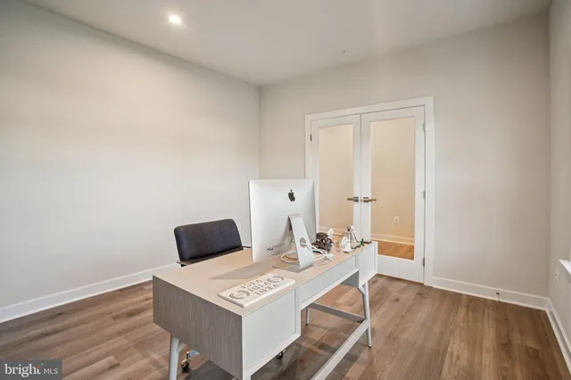 a large kitchen with lots of furniture a sink appliances and a dining table