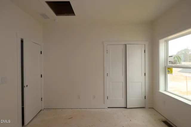 an empty room with windows