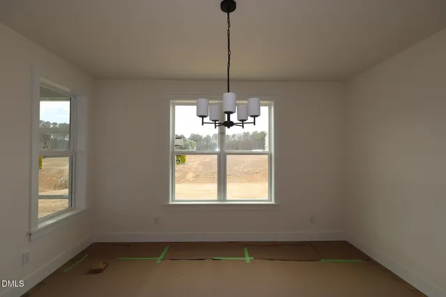 a room with window and ceiling fan