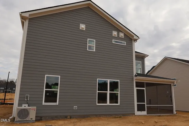 a front view of a house with a large window