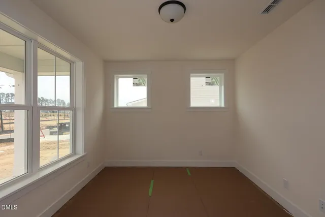 an empty room with windows