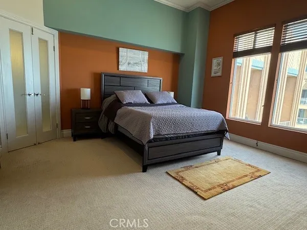 a bedroom with a bed and a walk in closet