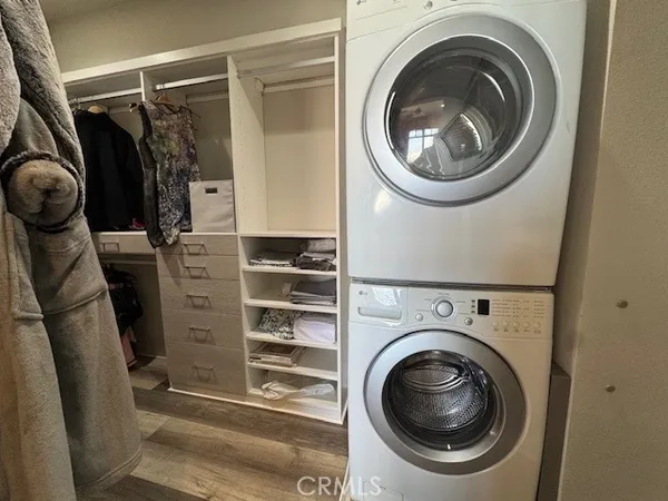 a bathroom with a glass shower door and a sink
