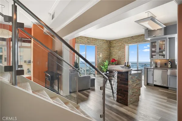 a kitchen with furniture and a window