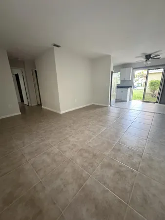 a view of empty room with a fireplace