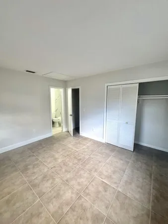 a bathroom with a sink mirror toilet and shower
