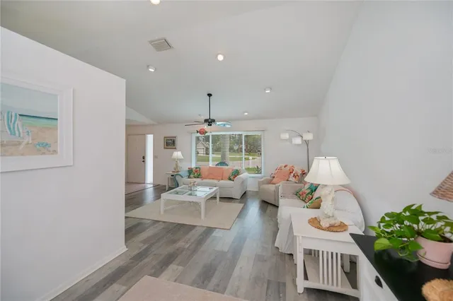 a kitchen with a sink appliances and cabinets