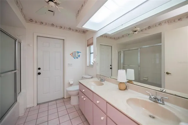 a view of a backyard with swimming pool and furniture