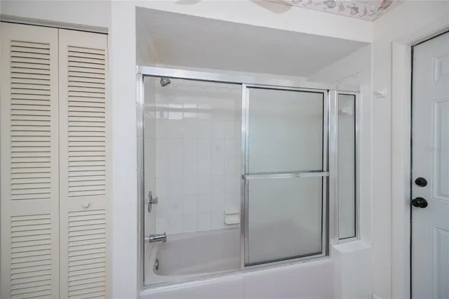 a backyard of a house with garden and plants