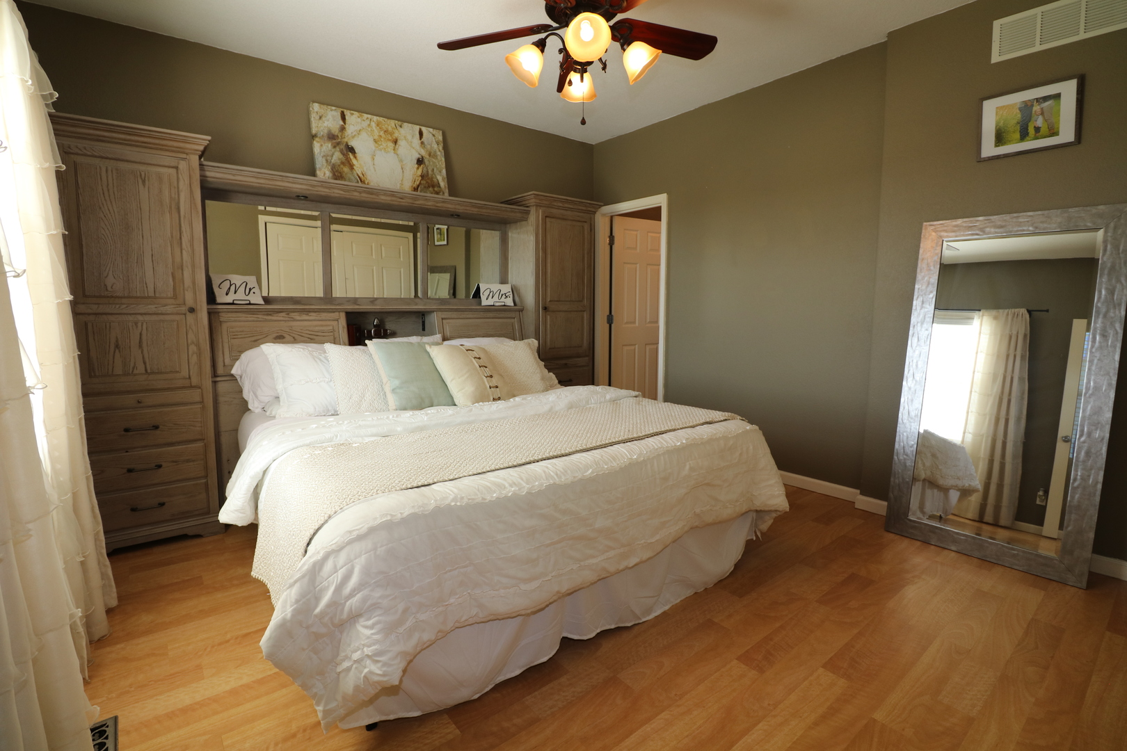 10942 Meridian Road Beason, IL 62512 - Photo 14 of 21 a bedroom with a large bed and a chandelier