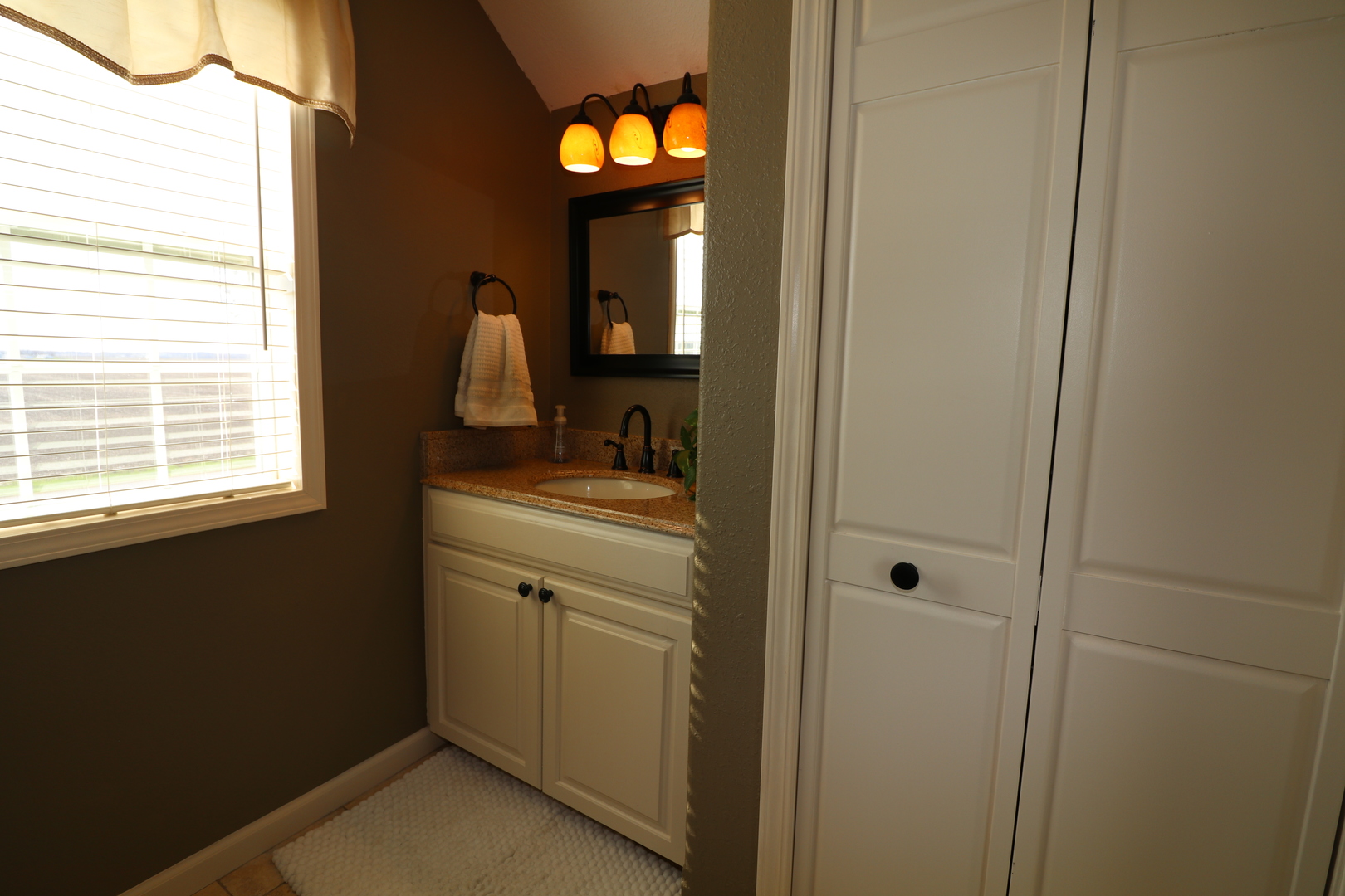 10942 Meridian Road Beason, IL 62512 - Photo 19 of 21 a bathroom with a sink and a mirror