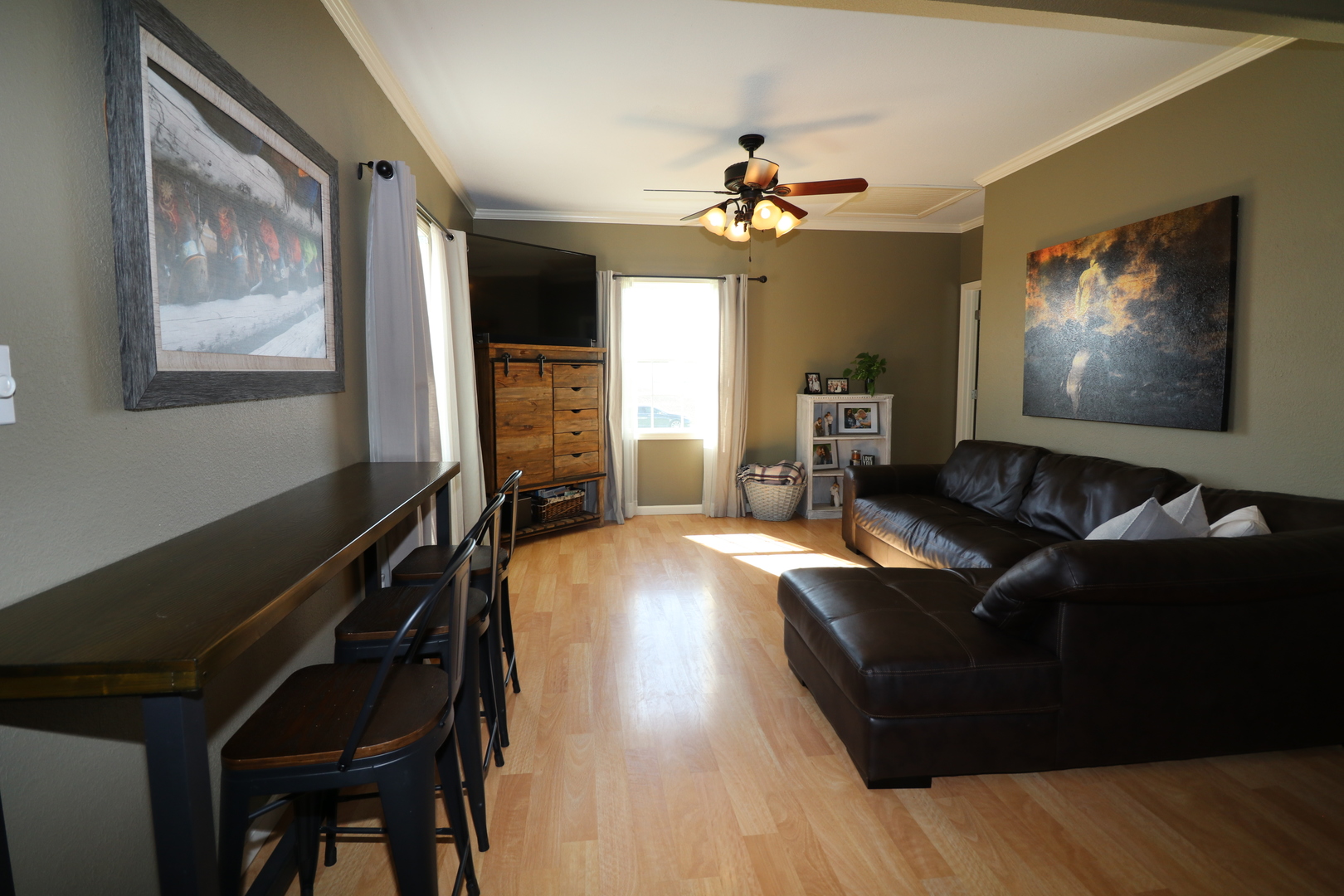 10942 Meridian Road Beason, IL 62512 - Photo 7 of 21 a living room with furniture and a flat screen tv with wooden floor
