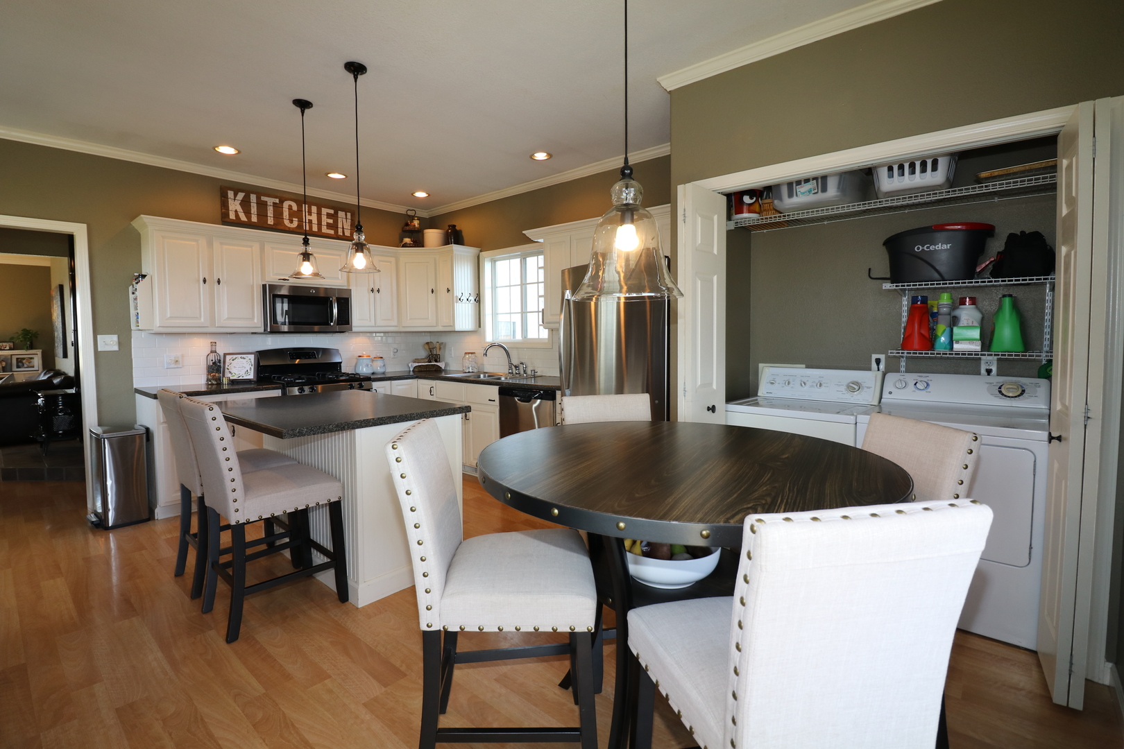10942 Meridian Road Beason, IL 62512 - Photo 10 of 21 a kitchen with a table chairs refrigerator and microwave