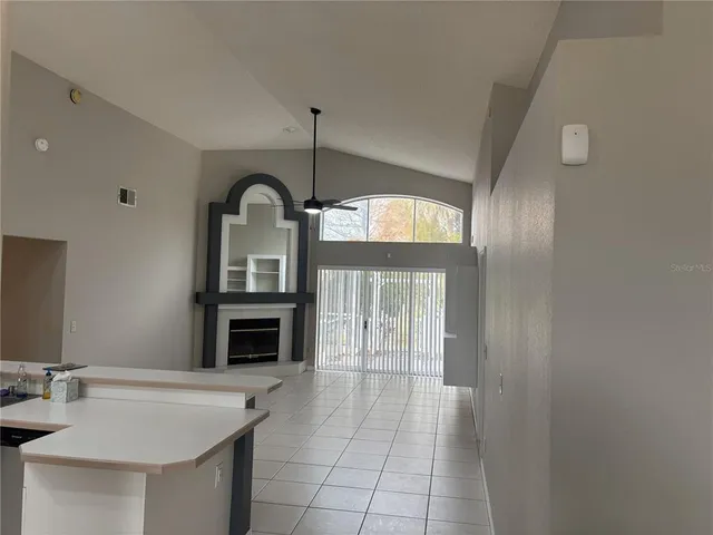 a view of living room with furniture and fireplace