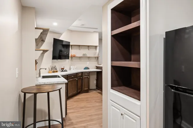 a kitchen with a sink cabinets and stainless steel appliances