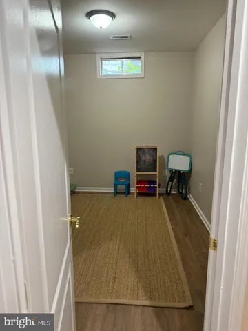 a room with a wooden floor and a table