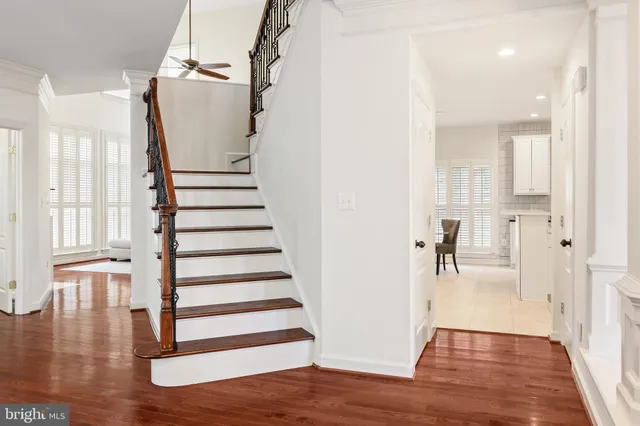 a view of entryway with wooden floor and stairs