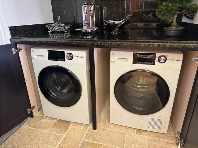 a bathroom with a sink double vanity and a granite
