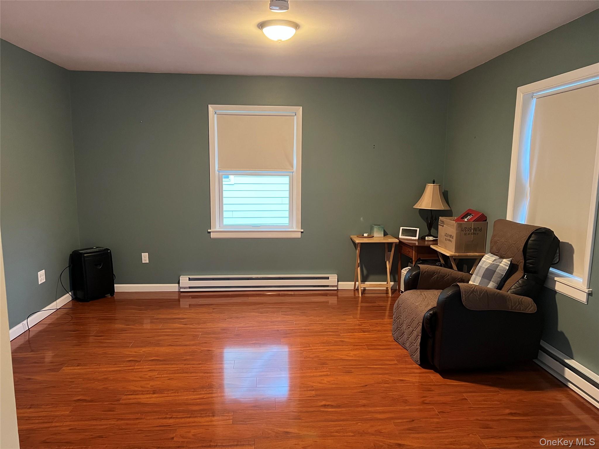 7 Bank Street, Unit 2 Cold Spring, NY 10516 - Photo 1 of 1 a living room with furniture and a wooden floor
