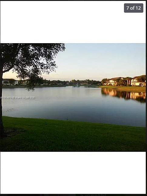 8395 Southwest 29th Street, Unit 102 Miramar, FL 33025 - Photo 1 of 20 a black and white photo of a lake
