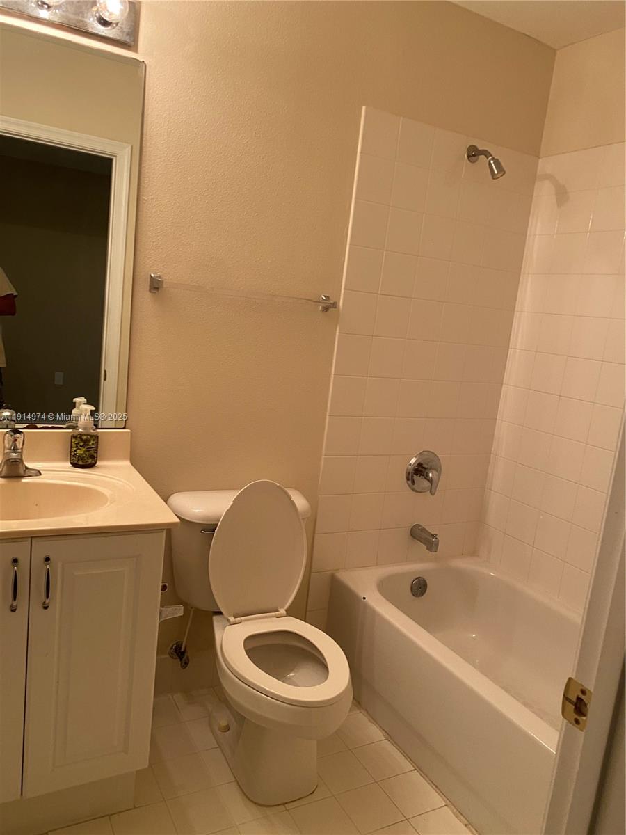 8395 Southwest 29th Street, Unit 102 Miramar, FL 33025 - Photo 16 of 20 a bathroom with a sink a toilet and bathtub