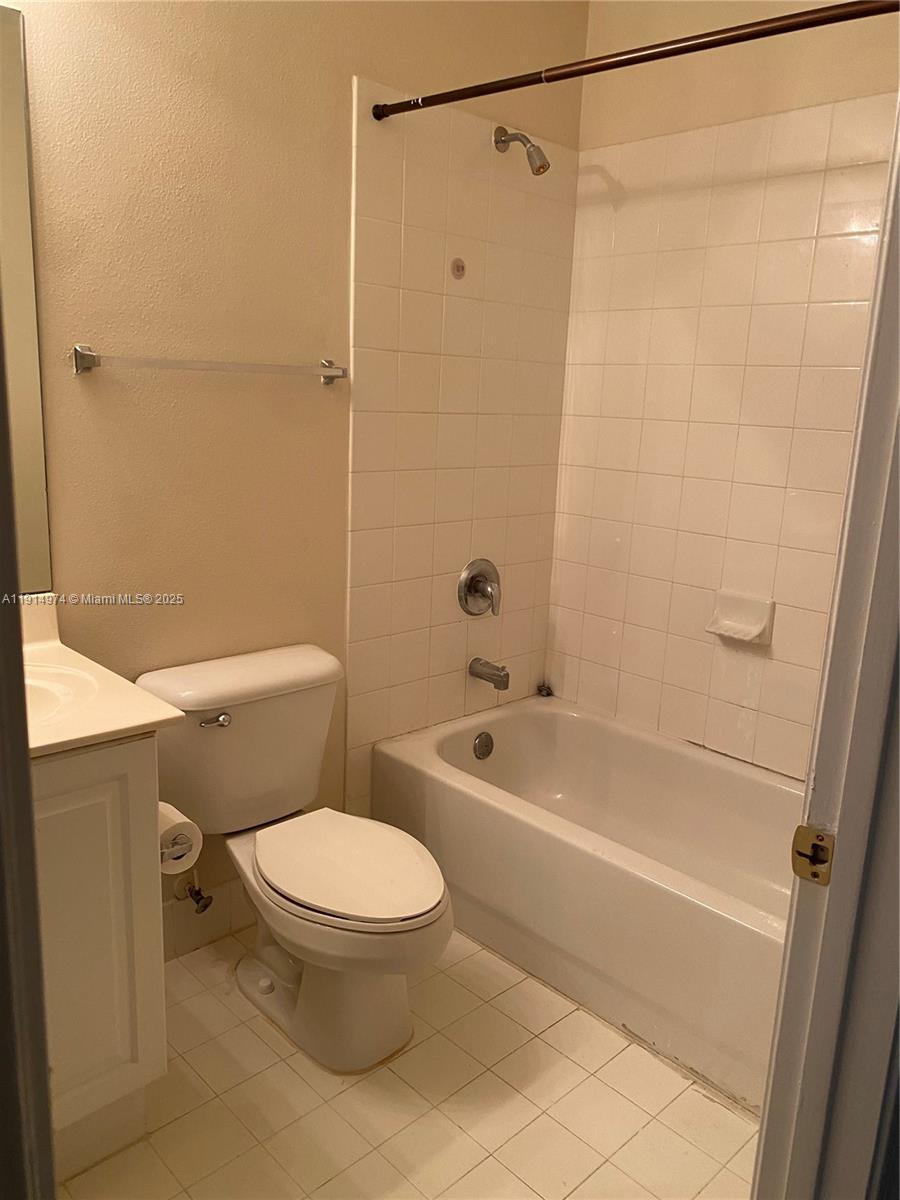 8395 Southwest 29th Street, Unit 102 Miramar, FL 33025 - Photo 19 of 20 a bathroom with a toilet and a bathtub