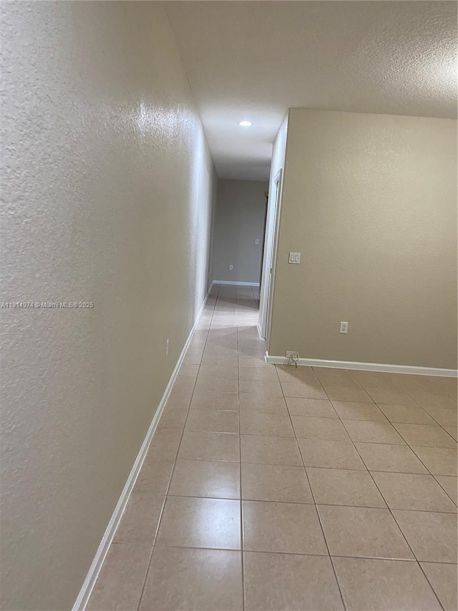 8395 Southwest 29th Street, Unit 102 Miramar, FL 33025 - Photo 9 of 20 a view of hallway with a window