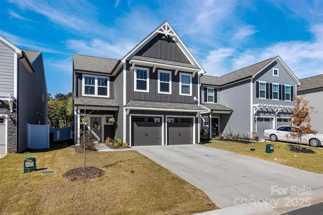 a view of a dry yard with trees