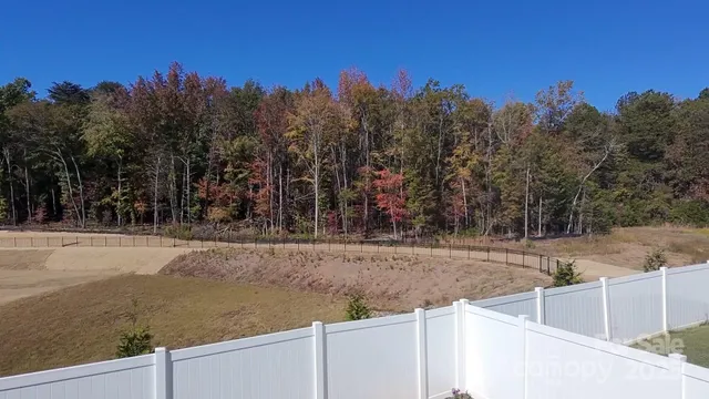 a view of outdoor space with trees all around
