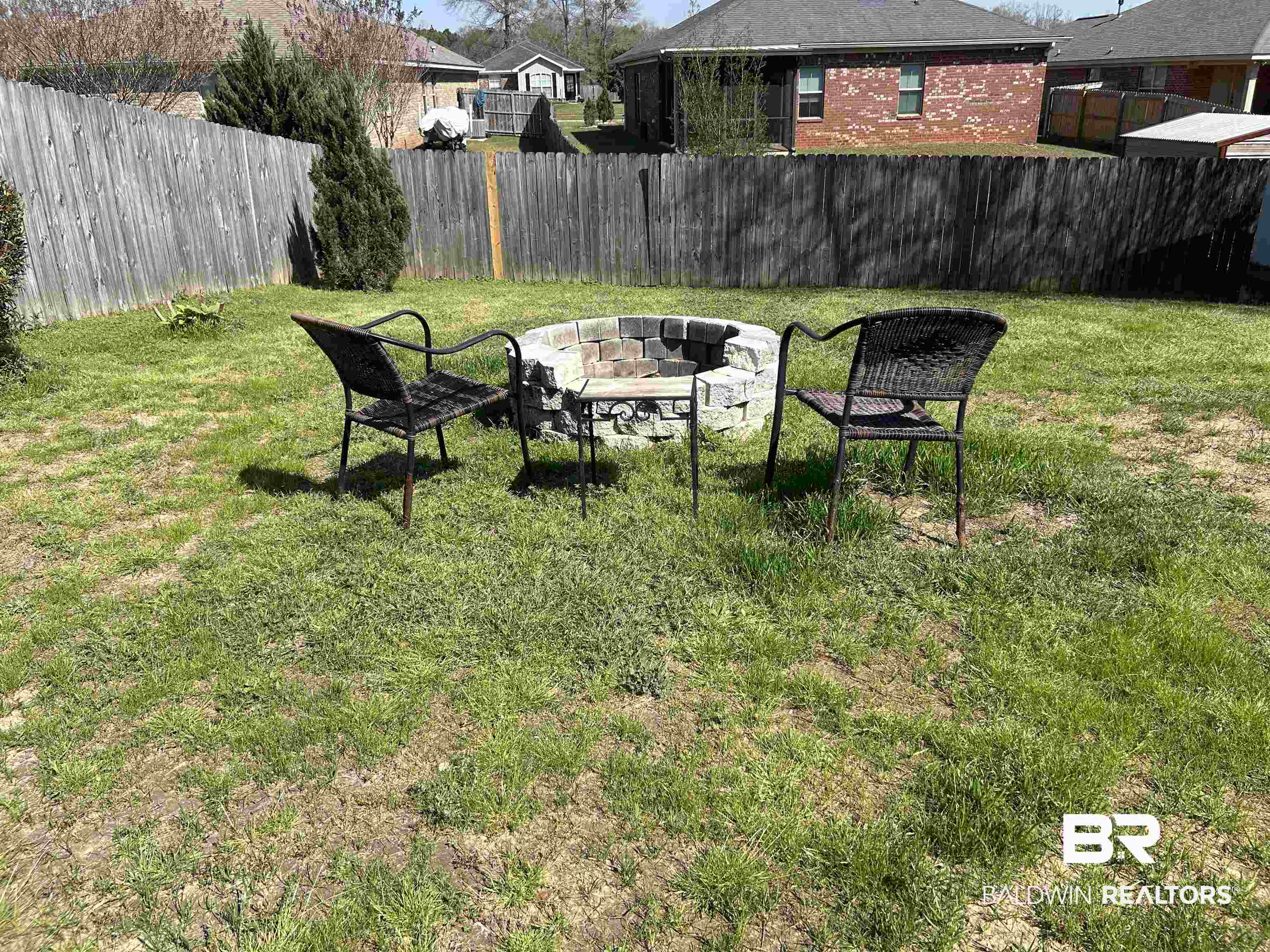 919 Parliament Court Mobile, AL 36695 - Photo 17 of 19 View of yard featuring fence and an outdoor fire pit