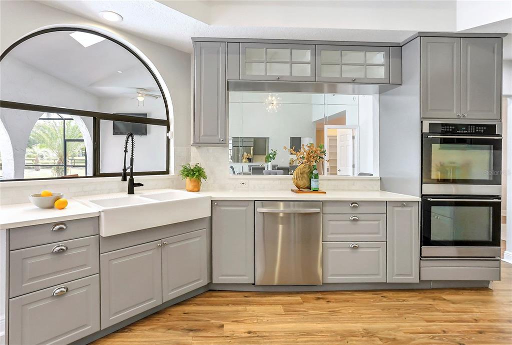 13124 Filly Court Windermere, FL 34786 - Photo 14 of 50 a spacious bathroom with a sink a mirror a vanity and a bathtub