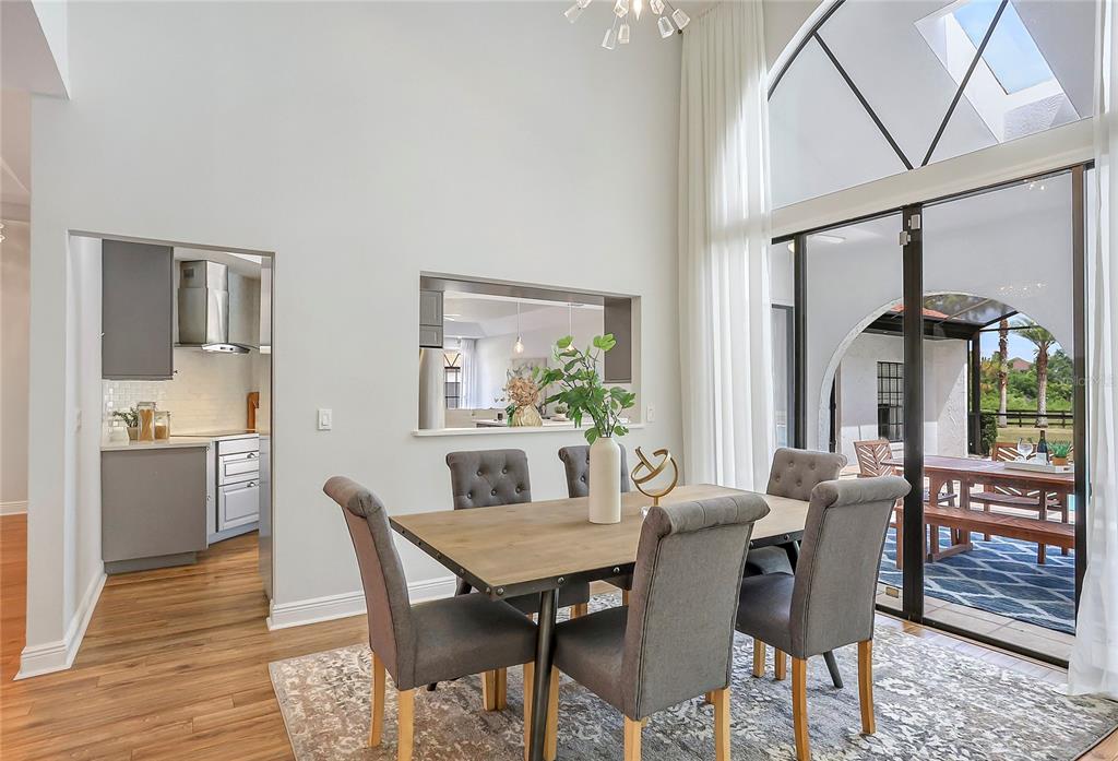 13124 Filly Court Windermere, FL 34786 - Photo 15 of 50 a view of a dining room with furniture window and wooden floor