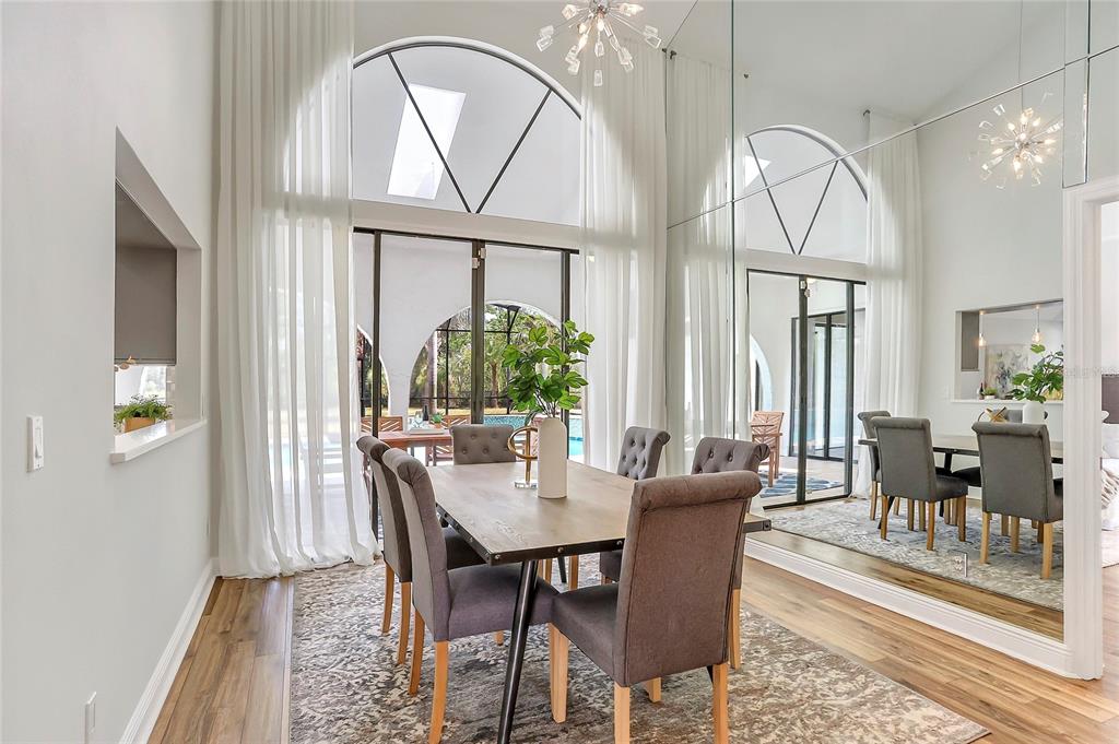 13124 Filly Court Windermere, FL 34786 - Photo 16 of 50 a dining room with furniture a rug and a chandelier