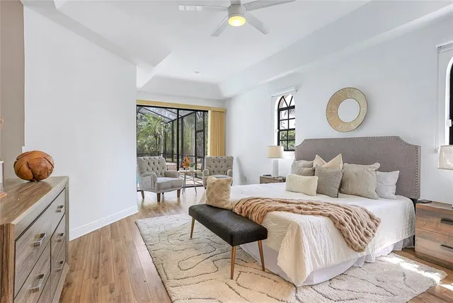 a bed room with a bed and a chair