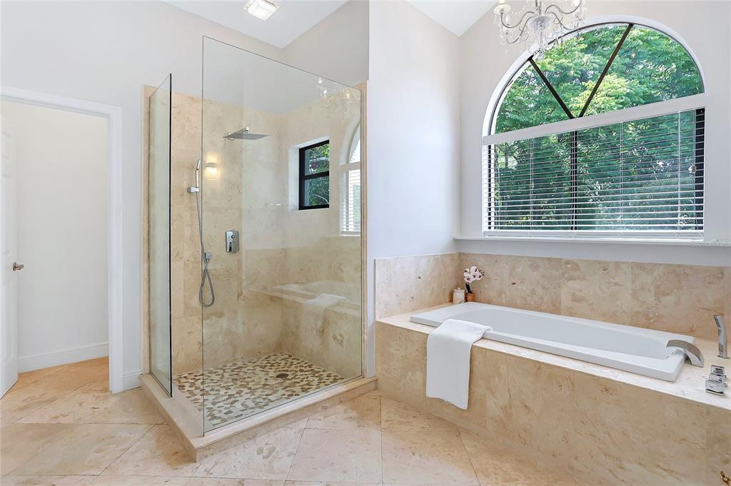 13124 Filly Court Windermere, FL 34786 - Photo 23 of 50 a bathroom with a sink a bathtub and window