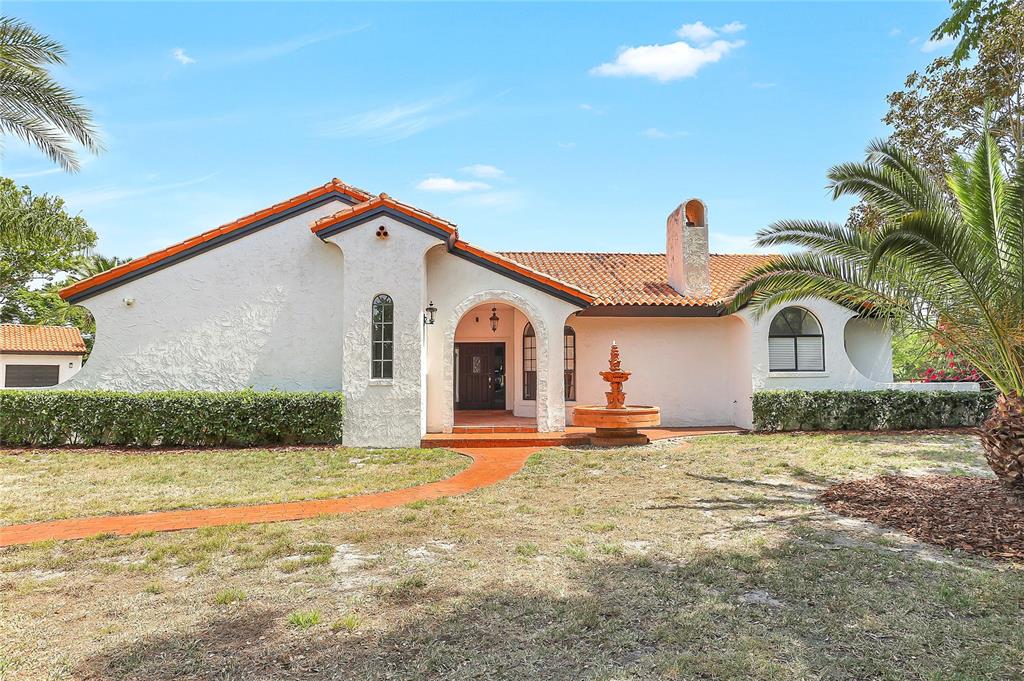13124 Filly Court Windermere, FL 34786 - Photo 3 of 50 a front view of a house with a yard