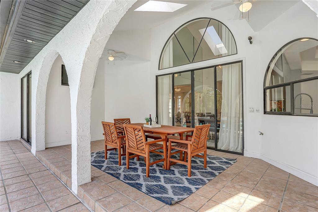 13124 Filly Court Windermere, FL 34786 - Photo 34 of 50 a view of a dining room with furniture window and wooden floor