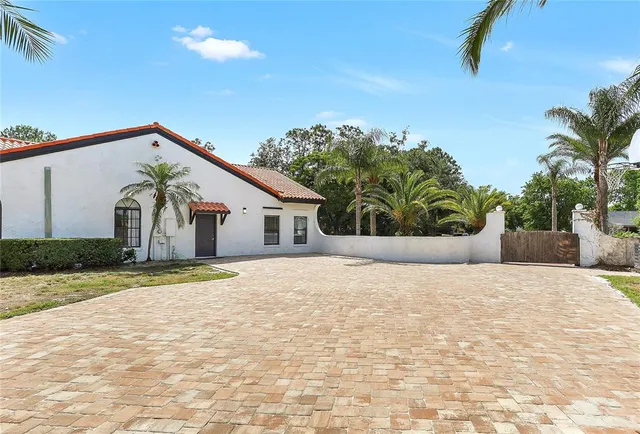 a view of house with yard and outdoor space
