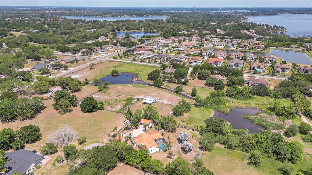 13124 Filly Court Windermere, FL 34786 - Photo 48 of 50 an aerial view of residential houses with outdoor space