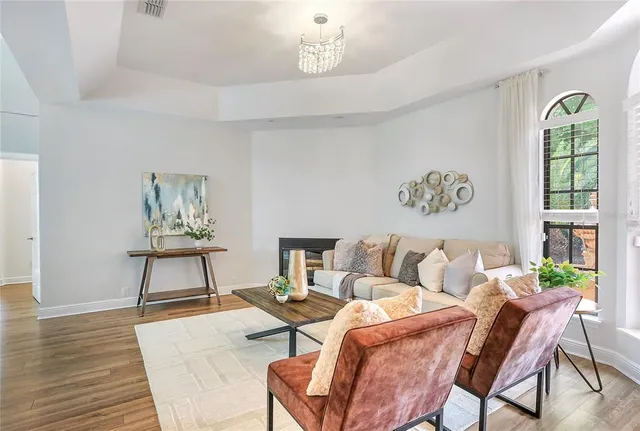 a living room with furniture and a window