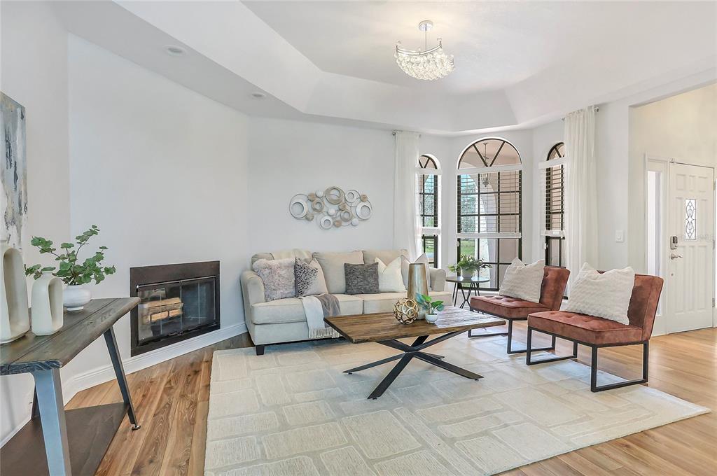 13124 Filly Court Windermere, FL 34786 - Photo 6 of 50 a living room with furniture and a fireplace