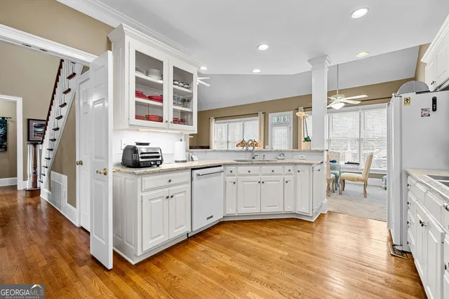 a view of an entryway with wooden floor and windows