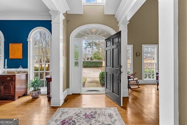 a view of an entryway with a hardwood