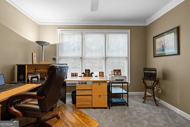 a living room with furniture and a book shelf