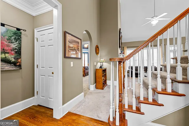a view of an entryway with wooden floor