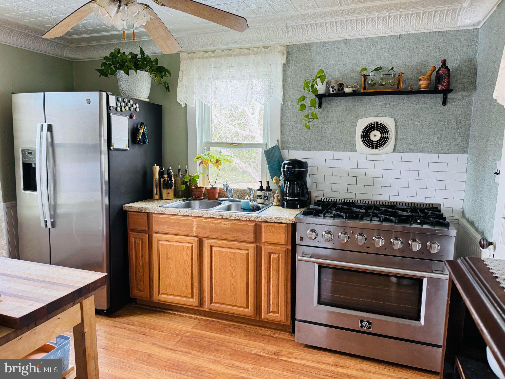 12704 Newland Road Warsaw, VA 22572 - Photo 6 of 8 Charming kitchen with modern touches.