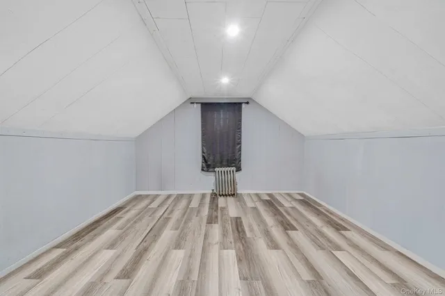 a view of wooden floor and windows in a room