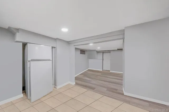 a view of room with wooden floor